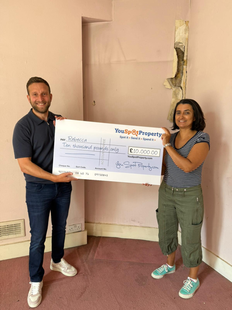 ben radstone presenting a cheque to rebecca